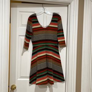 Multi-striped dress Altered State. 3/4 length sleeves. Skirt slightly flounced.